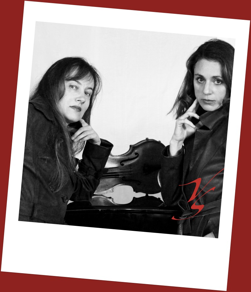 Two women posing thoughtfully in front of a violin, with a black and white color scheme and a red border.